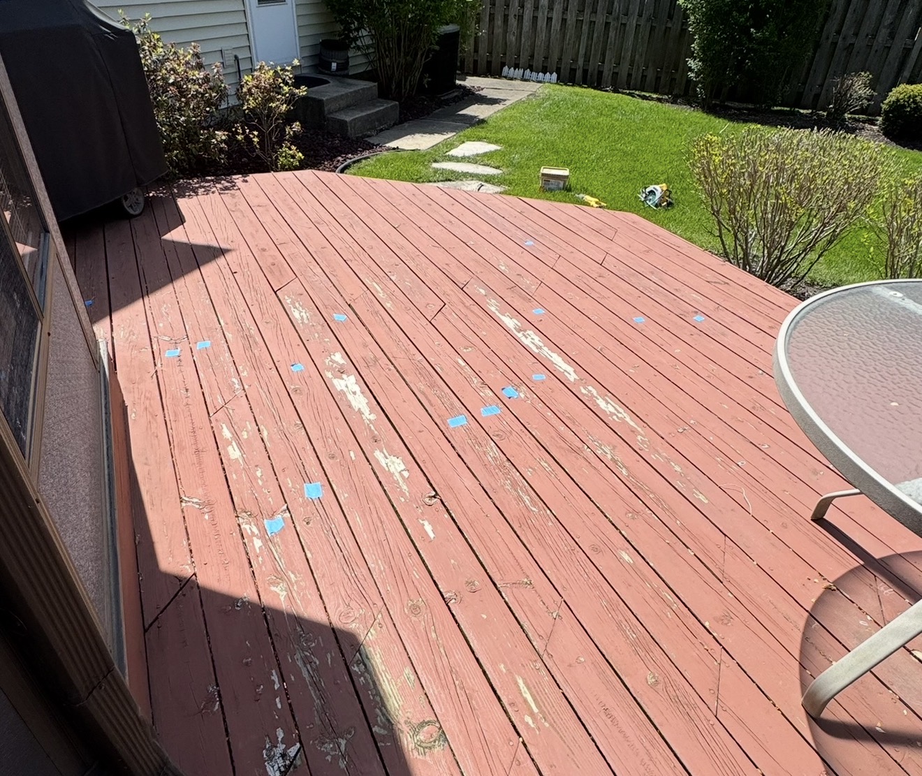 Cedar deck before restoration — weathered gray